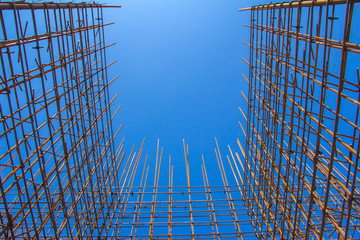 Armature against the blue sky. Metal base of reinforced concrete walls. Part of the structure of...
