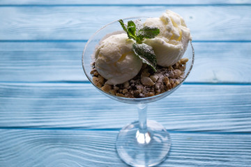 Ice cream on a blue wooden table.