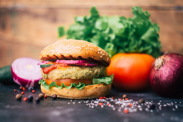 Vegetarian burger (home made burger) with chickpea cutlet and vegetables. Veg concept. Copy space.