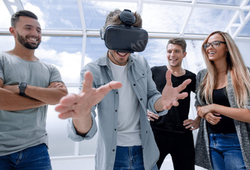 portrait of a young emotional man in glasses virtual realitY