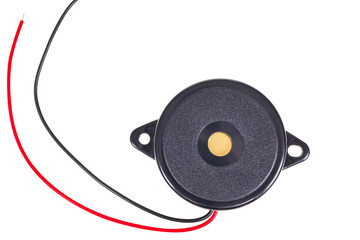 Thin passive electronic piezo buzzer on a white background