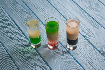 The alcohol shots on a table.