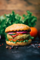 Vegetarian burger (home made burger) with chickpea cutlet and vegetables. Veg concept. Copy space.