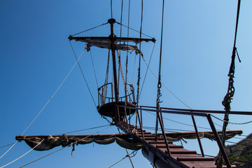 The mast of the ship against the sky. Symbol of success, heights. Rest on the Mediterranean sea in summer, Sunny day