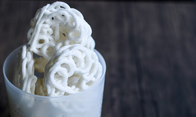 Kerupuk, Indonesian traditional crackers, on wood background.