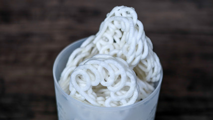 Kerupuk, Indonesian traditional crackers, on wood background.