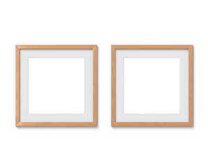 Set of 2 square wooden frames mockup with a border hanging on the wall. Empty base for picture or text. 3D rendering.