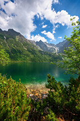Green water lake Morskie Oko, Tatry Mountains. - obrazy, fototapety, plakaty
