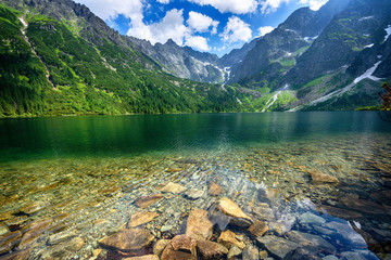 Green water lake Morskie Oko, Tatry Mountains. - obrazy, fototapety, plakaty