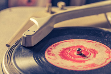 Old record player and old scratched vinyl records