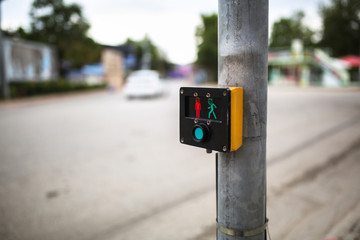 pedestrian crossing across road, button