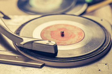 Retro gramophone and old scratched vinyl records
