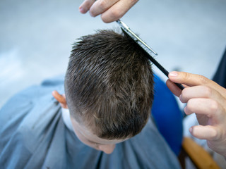 hairdresser cutting hair in salon