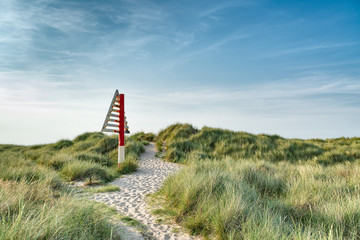 Triangular navigation sign on dune
