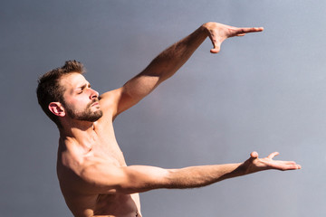 Young male dancer shows his hands dance motion