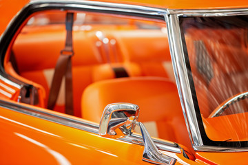 Close Up Of Matching Orange Interior Of Classic Car