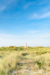 Triangular navigation sign on dune