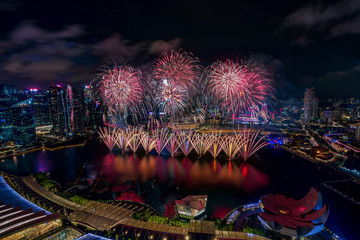 Aerial view of Singapore national day fireworks celebration at Marina Bay cityscape