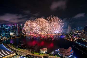 Aerial view of Singapore national day fireworks celebration at Marina Bay cityscape