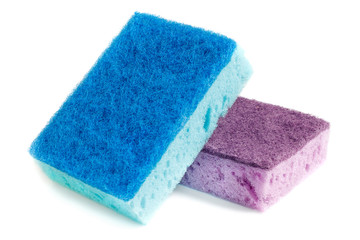 Domestic needs. Blue sponge lies on a purple sponge at a slight angle. isolate - obrazy, fototapety, plakaty