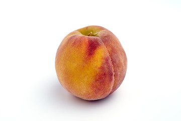 One peach isolated on white background.