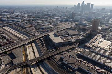 Fototapeta na wymiar Aerial view of streets, buildings, smog and the Los Angeles river near downtown LA in Southern California.