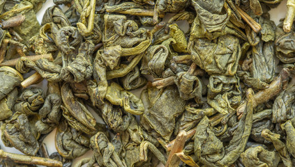 Green tea background texture. Green tea background or texture. Macro of dried green tea background texture. 