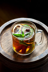 Glass cup of herbal tea with fresh mint
