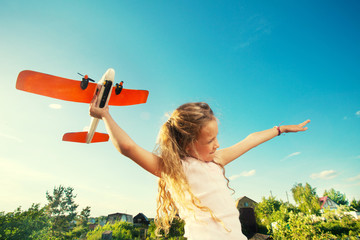 Girl playing with plane