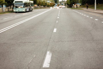urban car asphalted road in defocus, street without people, transport in the city