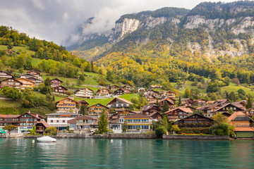 Fototapeta na wymiar Mountain village next to Thun lake in Interlaken , Switzerland