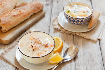 Finnish fish Soup with salmon, cream and potatoes in a bowl traditional soup in Nordic countries