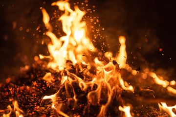fire flames with sparks on black background