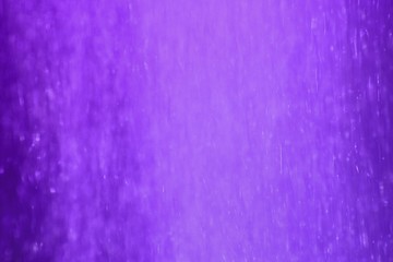 purple sparkling moving glitters long exposure texture - fantastic abstract photo background