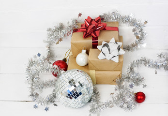 Naklejka na ściany i meble Happy new Year 2020 christmastime card. Gift boxes and christmas tree toys on background. Winter light rustic photo.