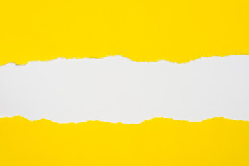 pieces of yellow paper on white background with copy space
