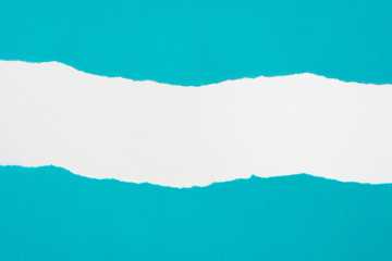 pieces of blue paper on white background with copy space