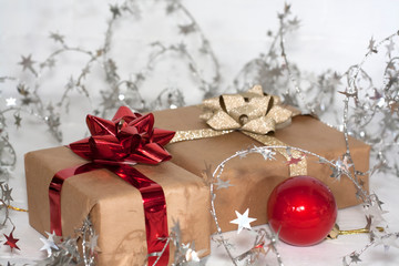 Happy new Year 2020 christmastime card. Gift boxes and christmas tree toys on background. Winter light rustic photo.