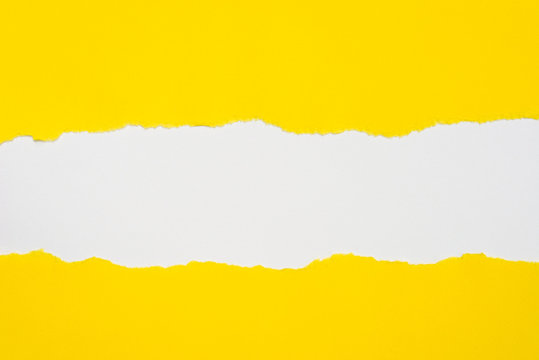Fototapeta pieces of yellow paper on white background with copy space