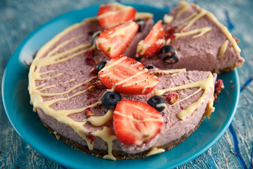 Raw healthy vegan cheesecake, homemade with cashew, mint and strawberries
