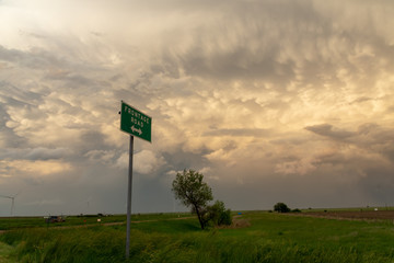 Road sign and mammatus clouds in Colorado, USA