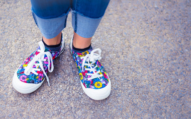 Original and stylish colourful woman shoes on the street - happy lifestyle