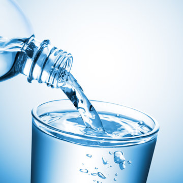 Purified Water Pouring From Bottle Into Glass Cup On Clean Gradient Background - Healthy Lifestyle Concept