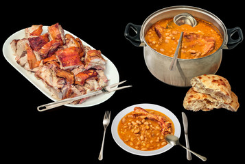 Gourmet Juicy Crunchy Spit Roasted Piglet Meat Chunks Served with Traditional Baked Beans and Pita Leavened Flatbread Loaf Isolated on Black Background