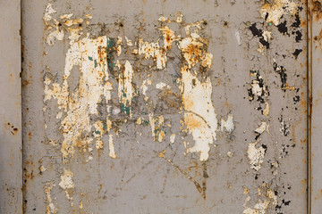 old shabby damaged plaster on the walls of houses close-up