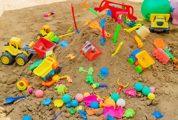 lot of children's toys in the sandbox. Selective focus. © yanadjan