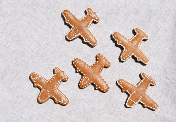 Gingerbreads in a shape of airplane on a light background