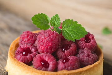Cake with fresh raspberries and mint