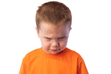 The little boy frowned angrily face and looking down, isolated on white background