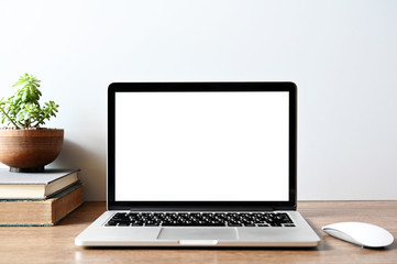 Laptop computer with blank screen in office